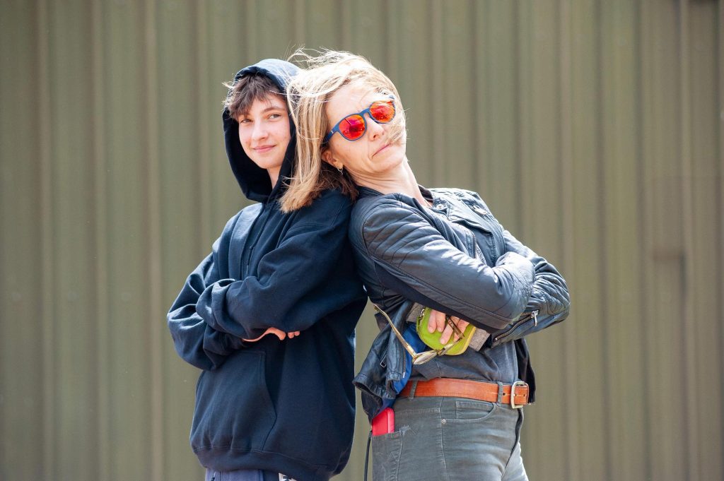A pupil poses with a teacher