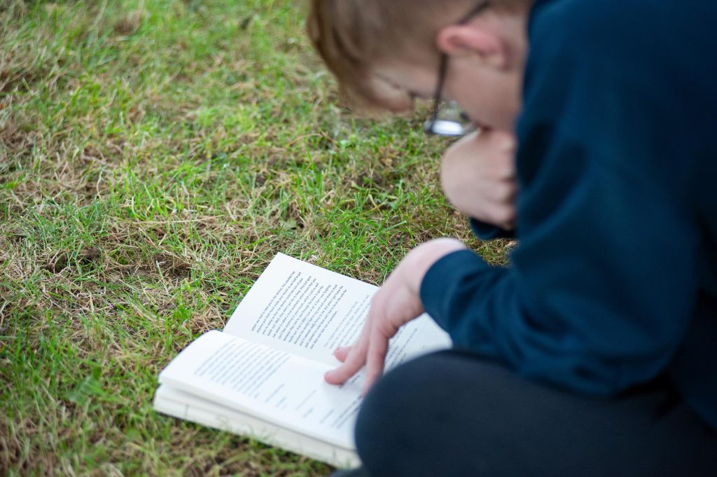 A pupil reads a book
